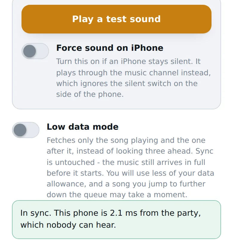 The Sync and settings sheet showing Play a test sound, Force sound on iPhone, Low data mode and an in sync message